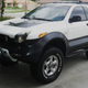 Illustration for article titled For $13,500, This 1999 Isuzu VehiCROSS Could Let You Pretend Youre Robert Downey Jr… Or Ozzy Osbourne